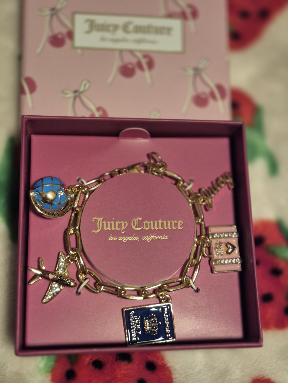 Juicy Couture Gold Tone Plane & Passport Charm Bracelet
